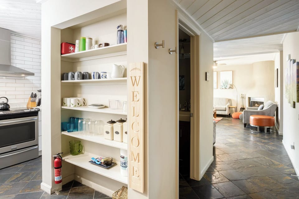 1st floor entry with half bathroom, first aid kit and fire extinguisher. 