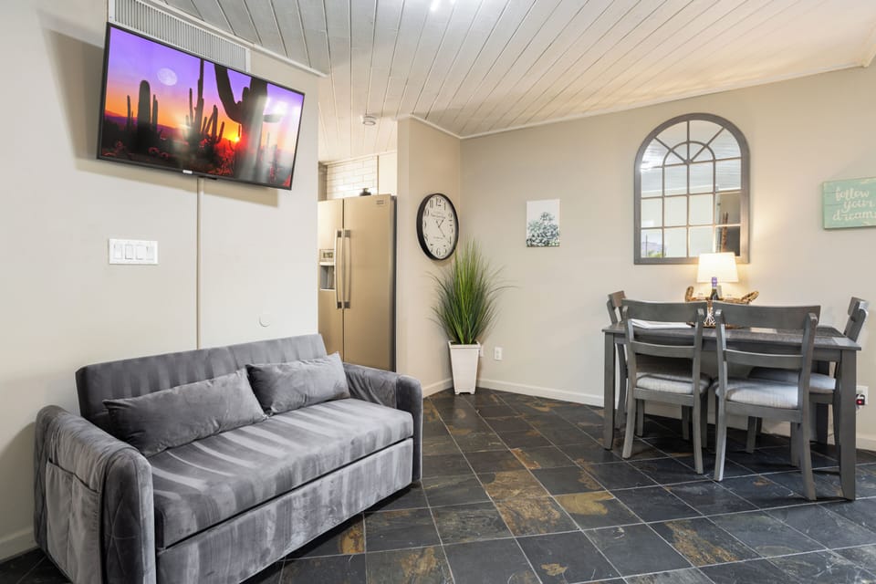 Dining area with a fold out queen size sofa bed, 43" TV with free Hulu&Netflix. 