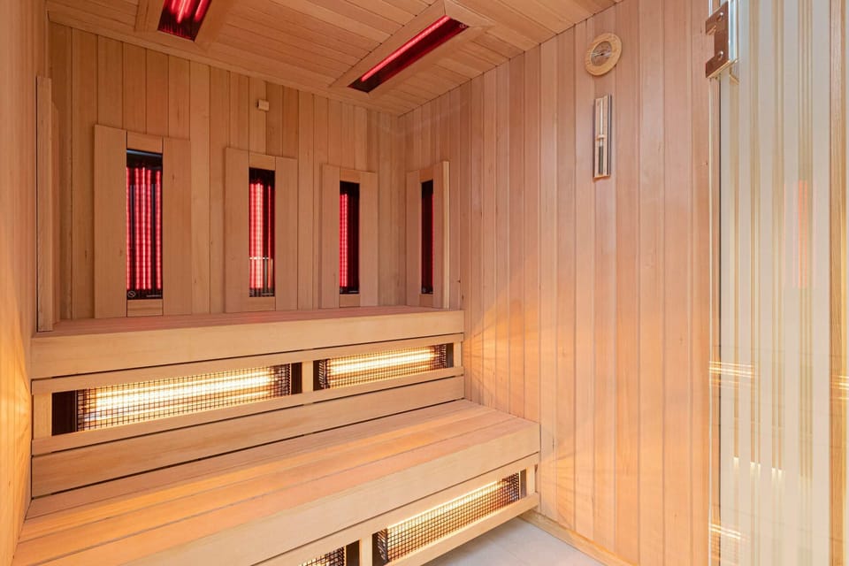 A luxurious sauna with wooden interiors, perfect for relaxation.