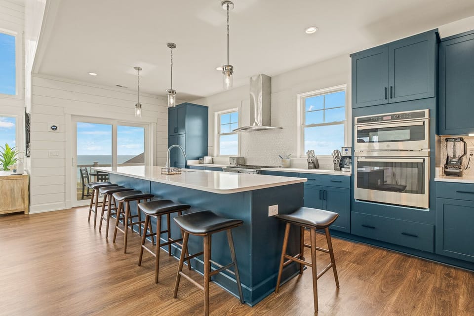 Kitchen with Bar Stool Seating on Third Level