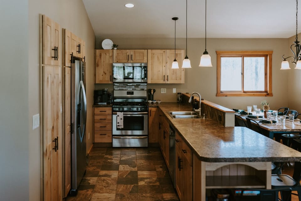 The fully equipped, newly renovated kitchen features sharp knives, an instapot, toaster, dishwasher, full coffee bar, pots, pans, and everything you need for quick meals.