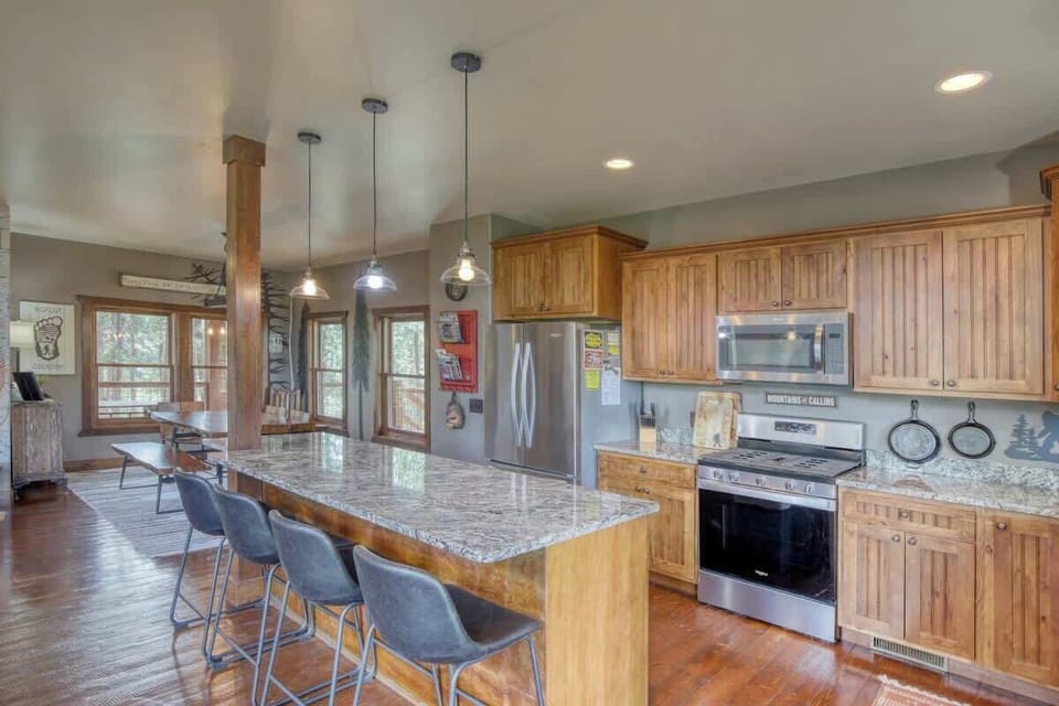 Main floor kitchen and breakfast bar with seating for 4