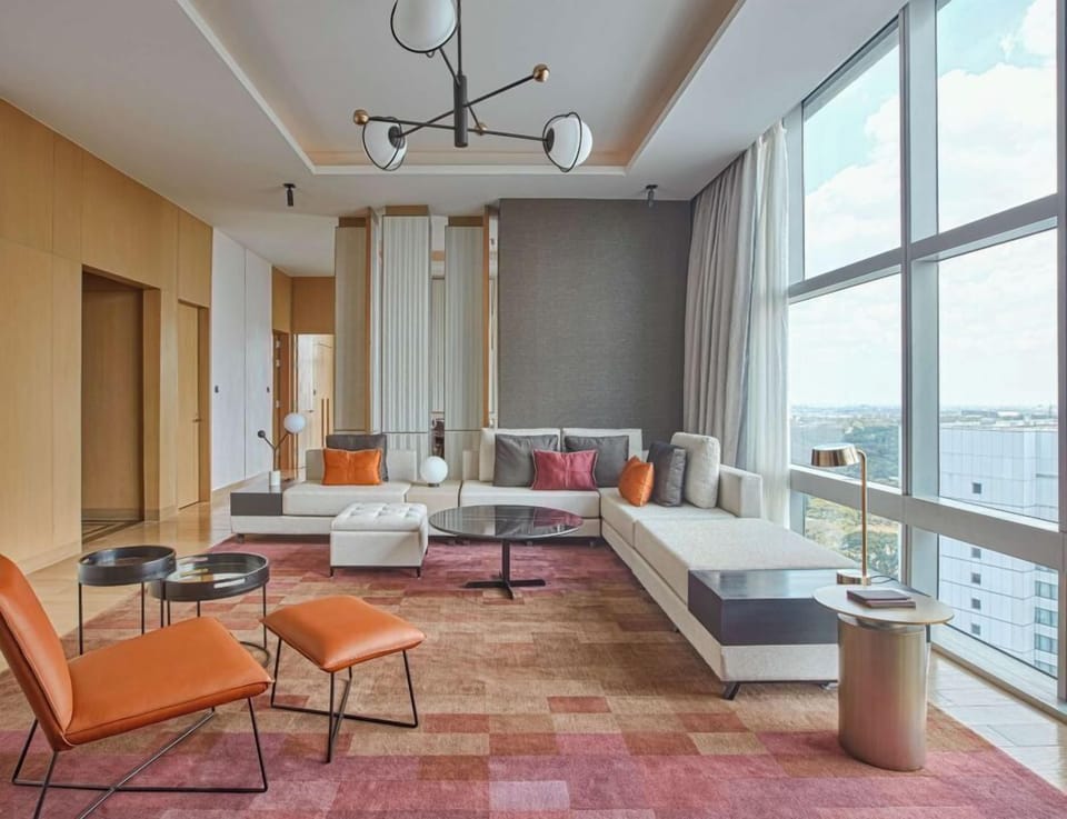 Swiss Prestige Suite, 1 King Bed | Living area | 55-inch flat-screen TV with cable channels, TV