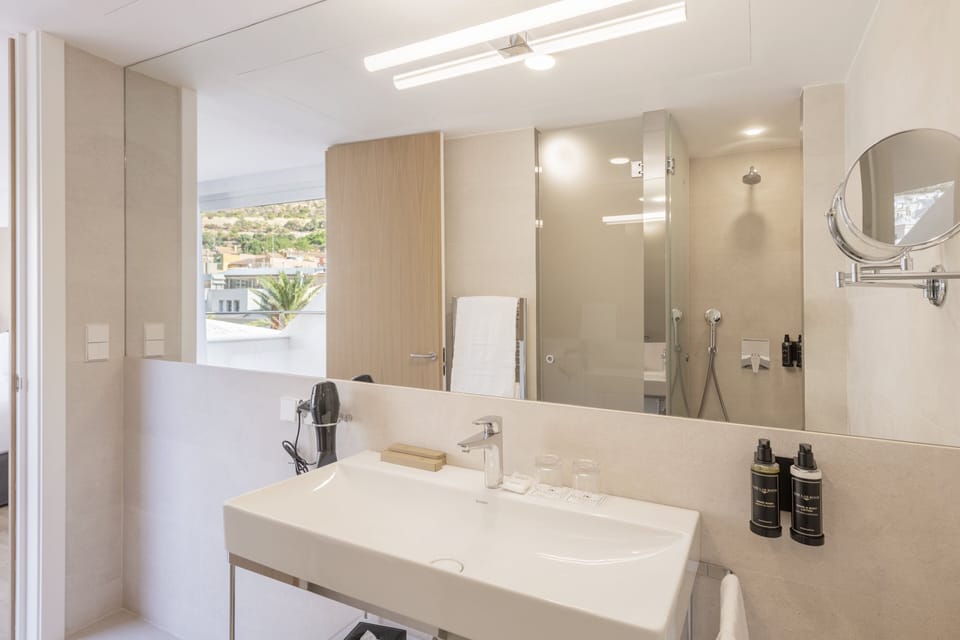 Shower, eco-friendly toiletries, hair dryer, bathrobes