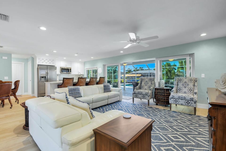 Huge open living room with electric reclining couch and love seat.