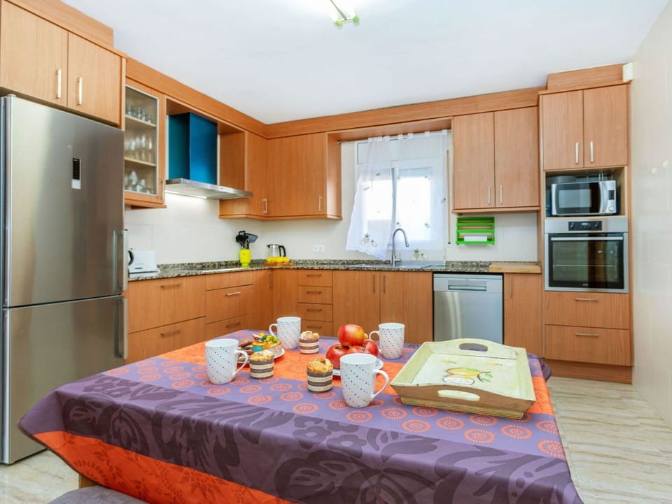 Furniture, Kitchen, Interior Design, Flooring, Wood, Kitchen Appliance, Major Appliance, Countertop, Cabinetry, Floor