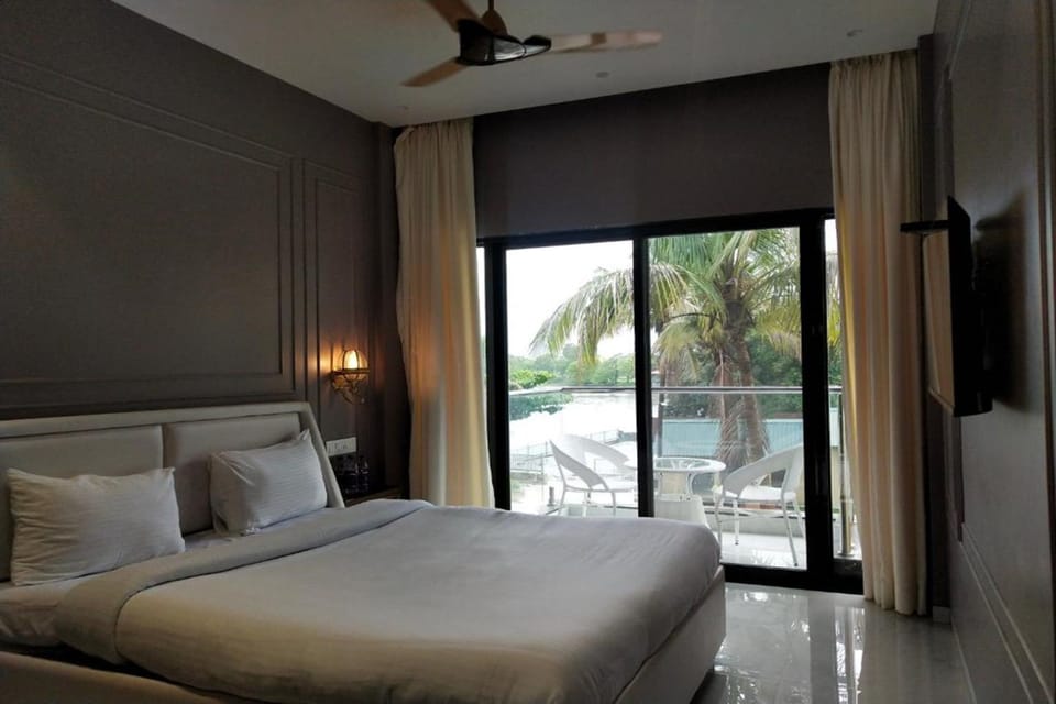 Executive Pool View Room | Desk, blackout drapes, iron/ironing board, free WiFi