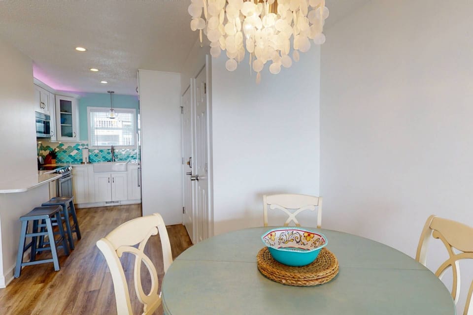 Fun light fixture over the table with seating for 4. Additional bar seating is also available.