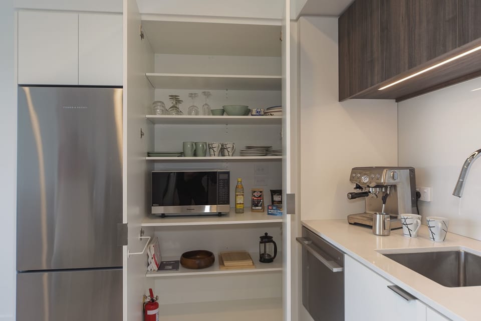 Well-equipped pantry with Microwave
