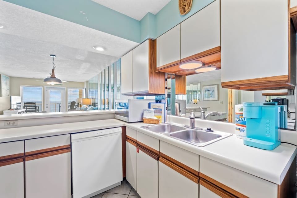 Your fully equipped kitchen features modern appliances and warm wood accents, perfect for preparing meals during your stay.