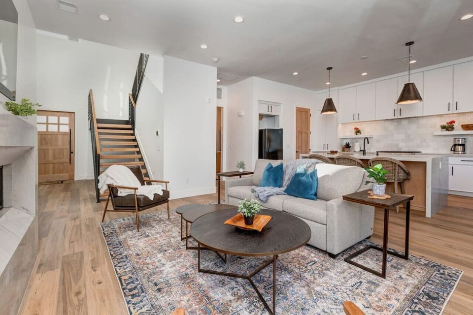 Beautiful great room, with fireplace and chefs kitchen. Couch turns into a queen bed if needed.
