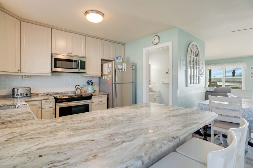 Solid Surface Countertops and Stainless Appliances.