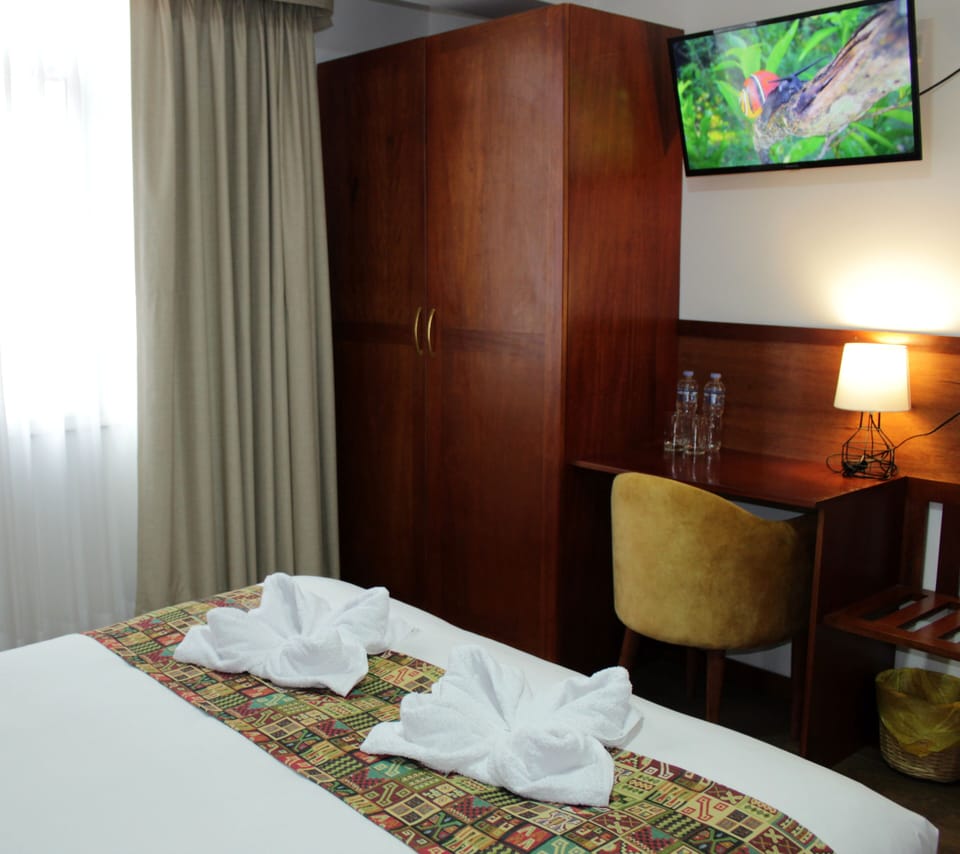 Desk, laptop workspace, WiFi (free), bed sheets