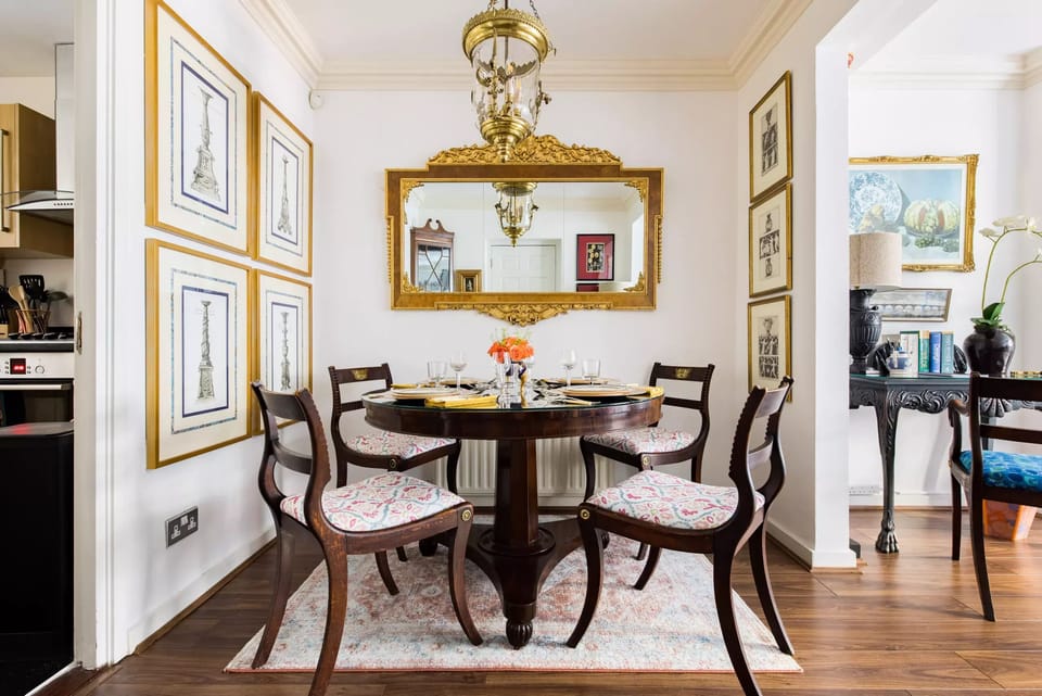 Dining area — 1840s table and 1780s chairs.