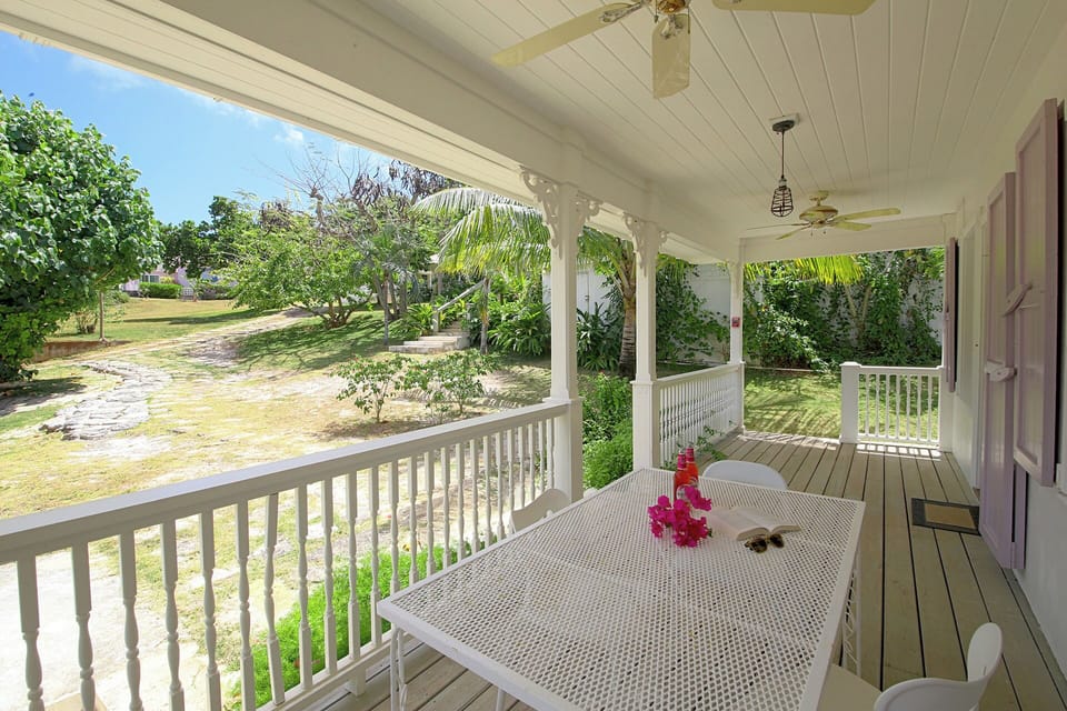 Alfresco dining area overlooking estate gardens.