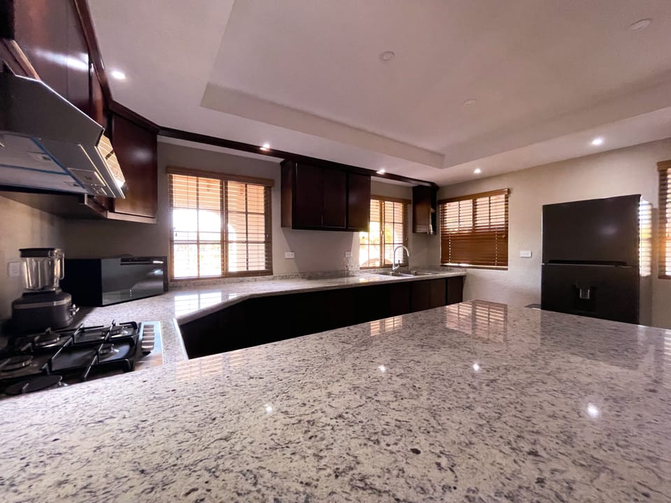 Deluxe Villa | Private kitchen | Espresso maker, cleaning supplies, paper towels