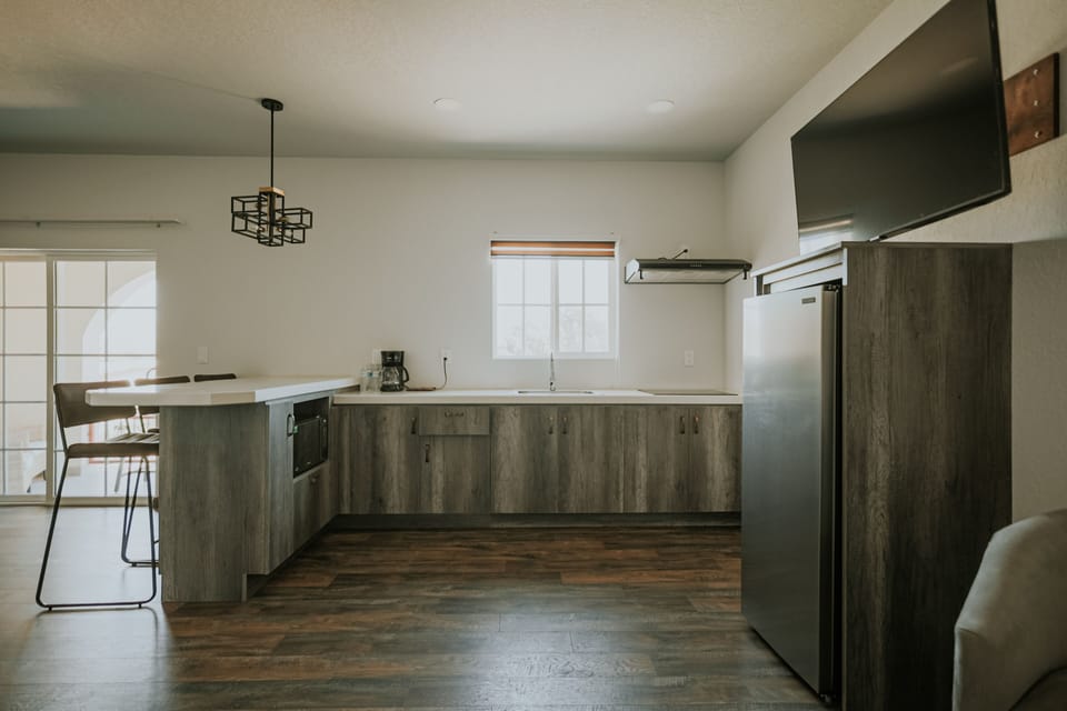 Deluxe Studio Suite | Private kitchen | Espresso maker, cleaning supplies, paper towels