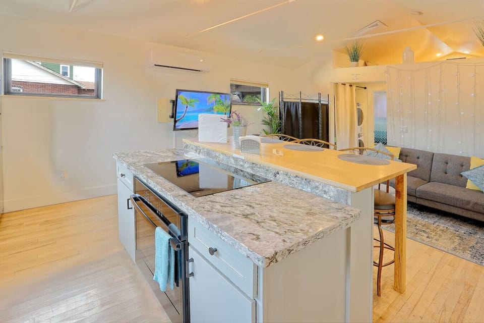 Open kitchen with bar seating for easy meals and conversation.