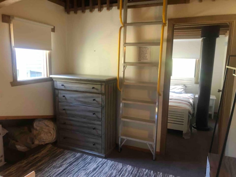 Ladder that goes up to the loft with 2 single beds and a Smart TV-great for kids
