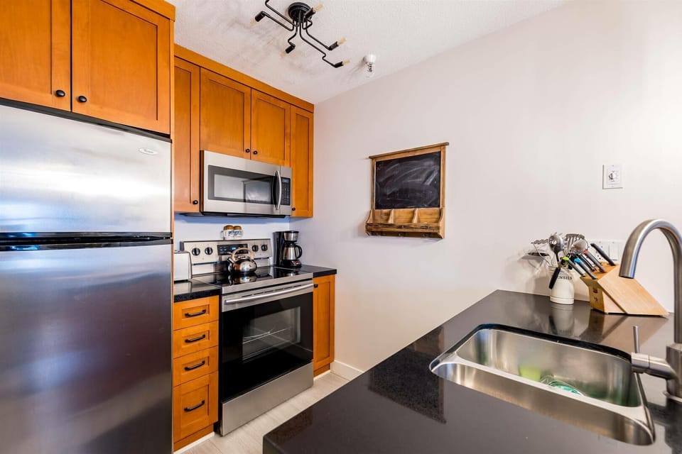 Prepare meals with ease in a modern kitchen that combines function and style.