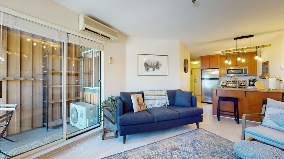 Enjoy downtime in the cozy lounge, where mountain light pours in and comfort surrounds you.