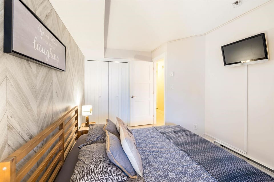 Tucked away from the living space, the master bedroom invites deep sleep and morning calm.