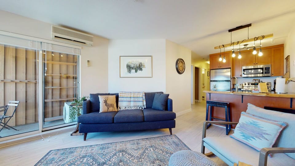 A bright and comfy living area invites you to relax after exploring Whistler's trails and slopes.