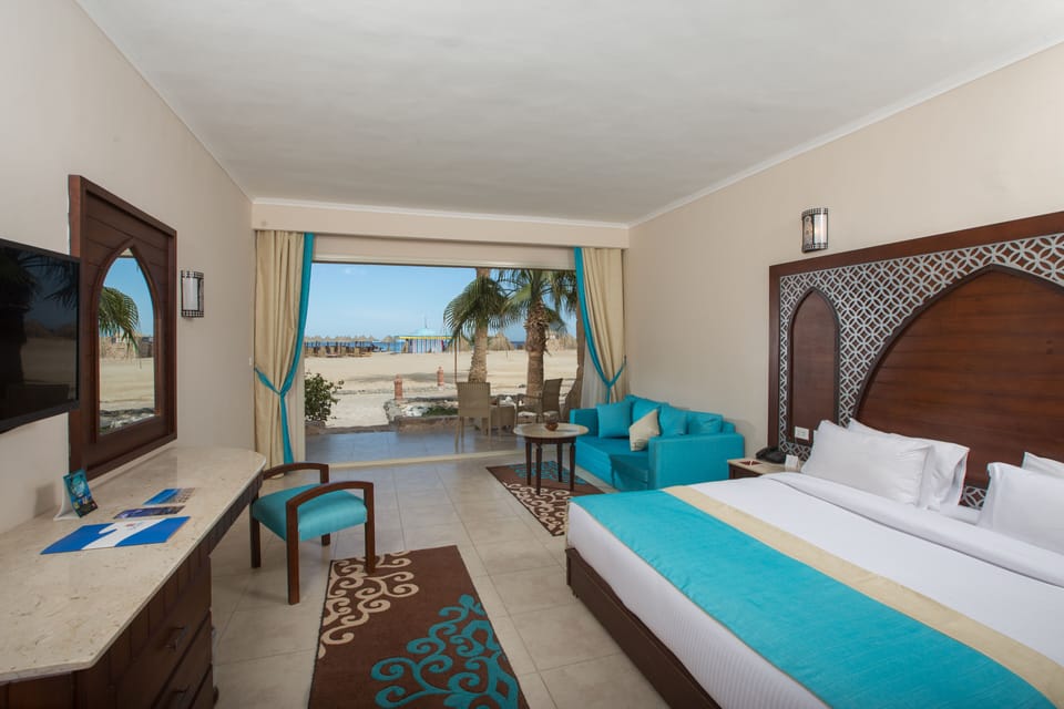 Deluxe Room, Beachfront | Minibar, in-room safe, individually decorated, individually furnished