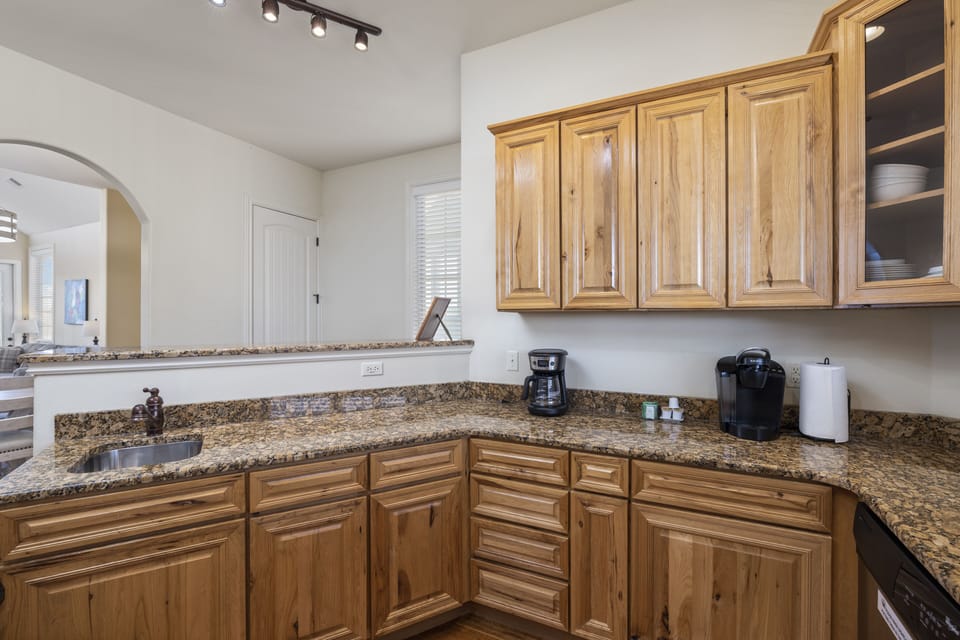 Kitchen equipped with a coffee pot, keurig, tea kettle and toaster 