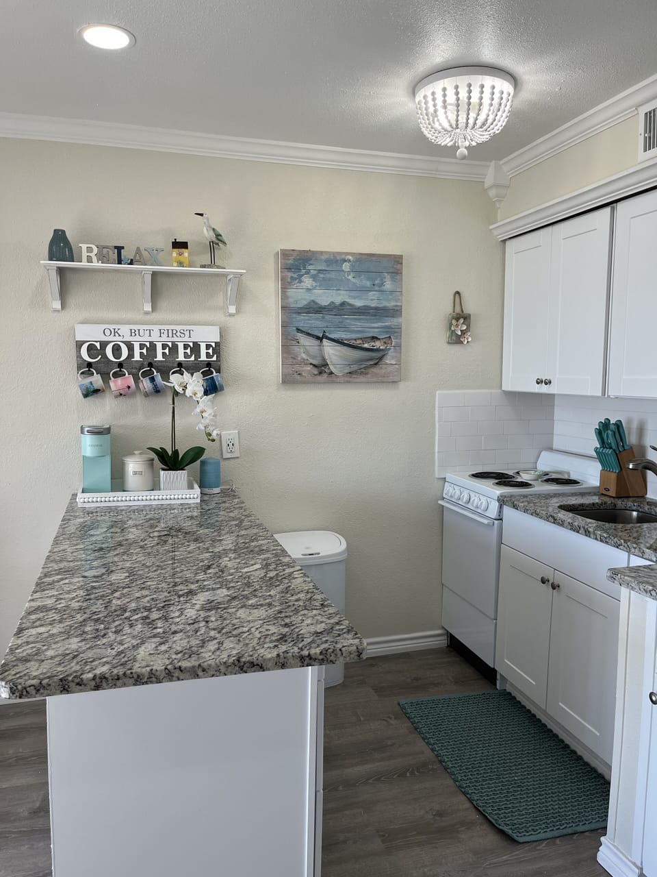 Kitchen has Keurig coffee machine, toaster, microwave, blender, and hand mixer.