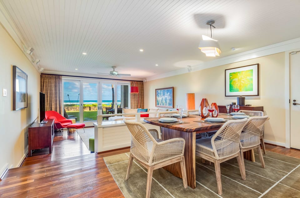 Open-concept living and dining with unobstructed views to the ocean beyond.