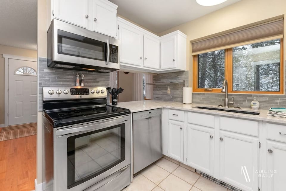 Full kitchen with a drip coffee machine, ground coffee, tea, sugar and basic condiments (ketchup, mustard and relish.)