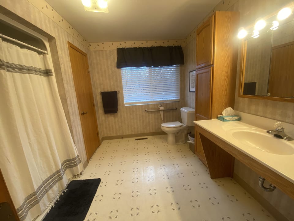 This bathroom with walk-in shower is part of "The Pampered Cow" guest bedroom.