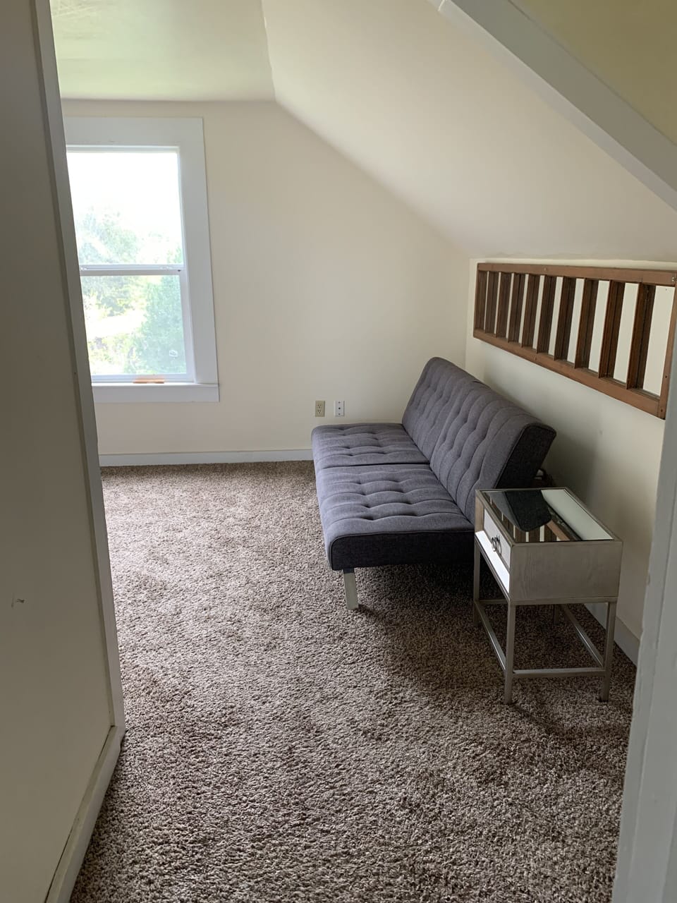 Upstairs sitting room with fold out couch.