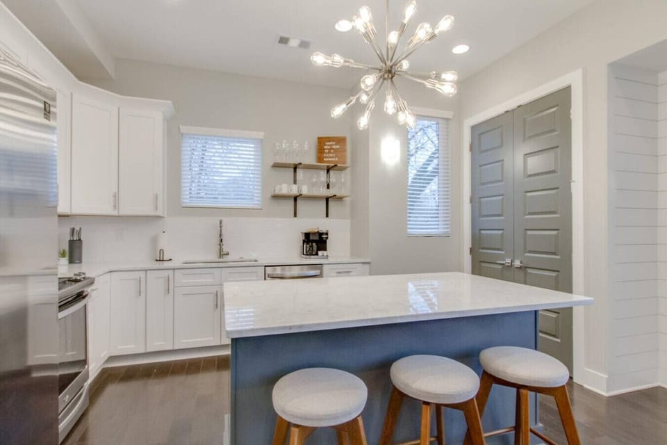 Well-appointed kitchen with a large island and stainless steel appliances