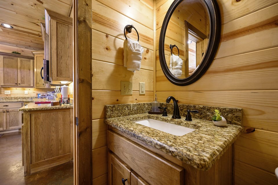 Lower level half bath close to kitchen and living