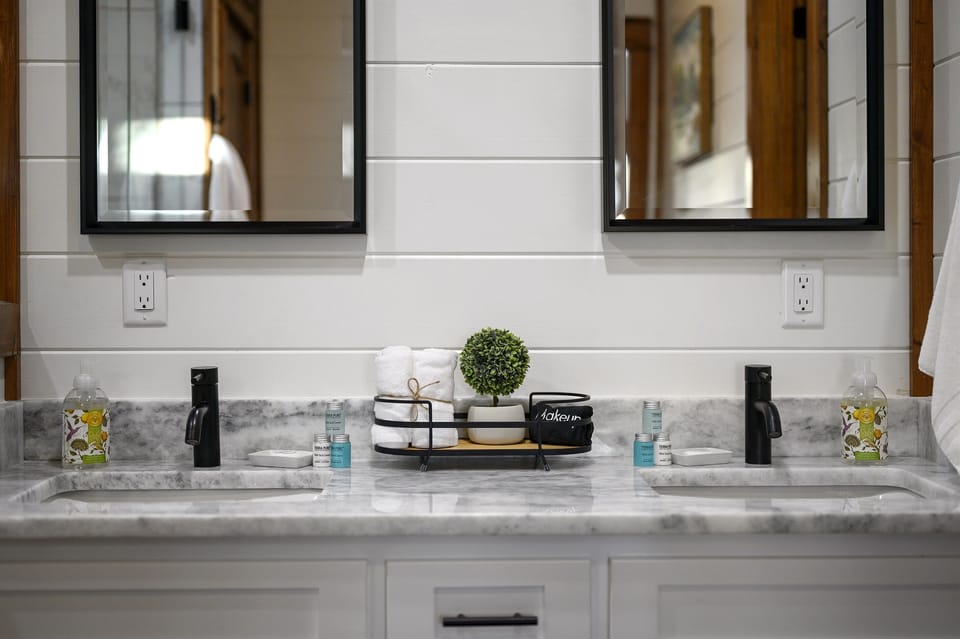 Bathroom Oasis: Elegant double vanity with stylish decor and premium amenities for your comfort!