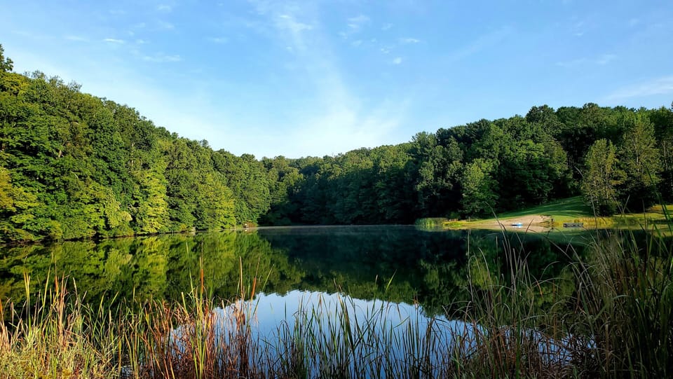 View of the 9-acre lake that includes a sandy beach area just a short walk away!