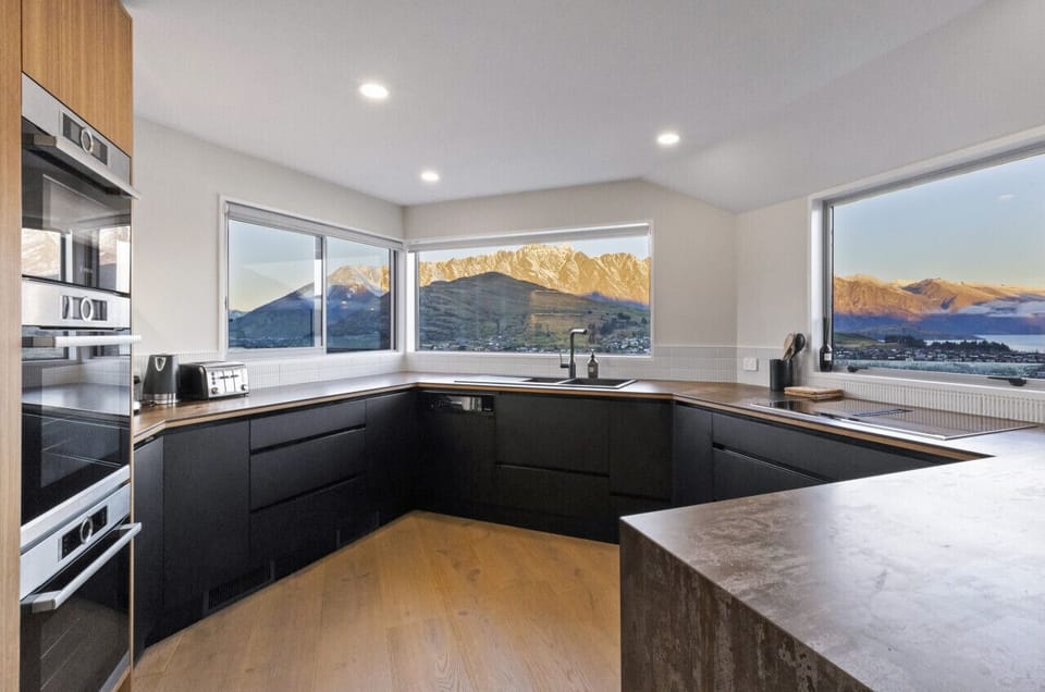 The renovated kitchen is fully-equipped with an induction cooktop, dishwasher, double oven, microwave and coffee machine.