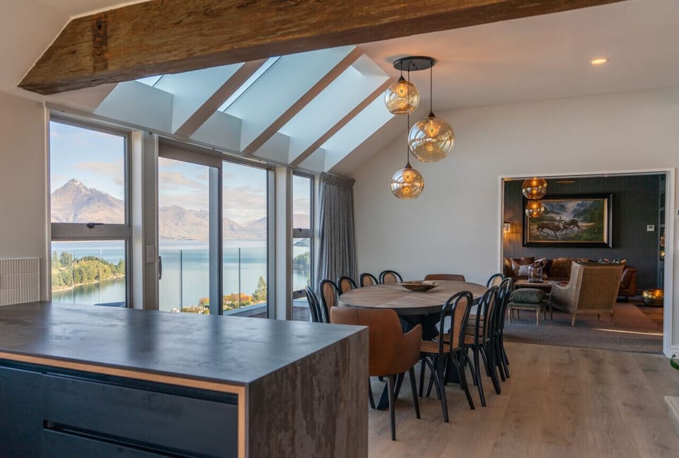 The central dining room on the main level provides easy access to the separate living spaces, giving guests ample space to spread out.
