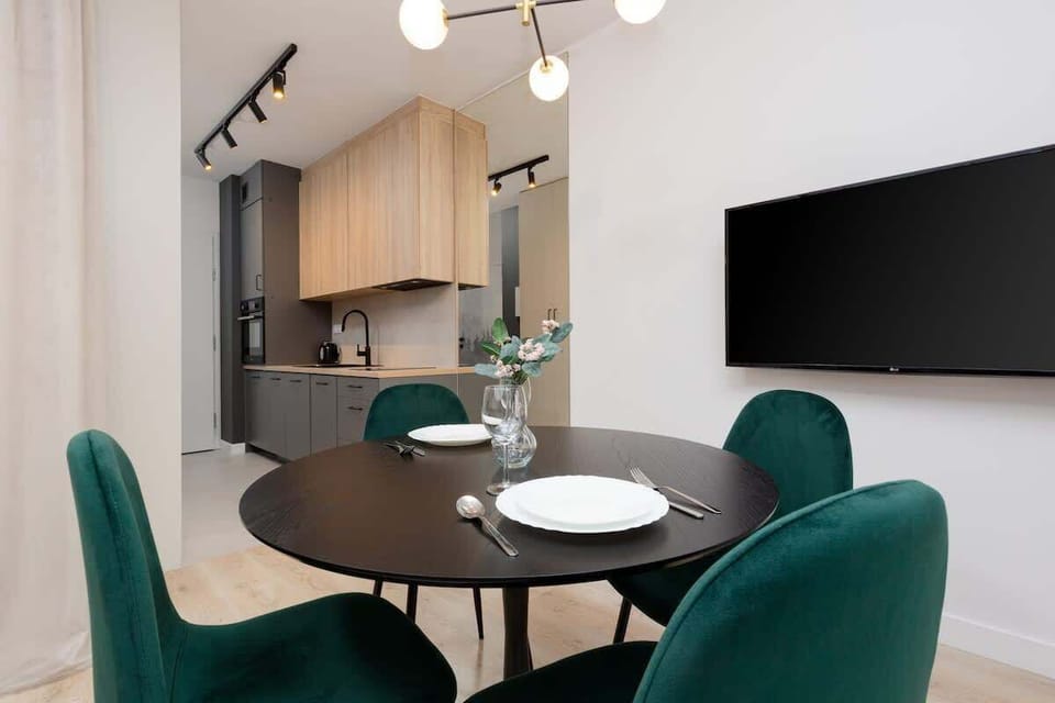 Large table with chairs for eating communal meals. 