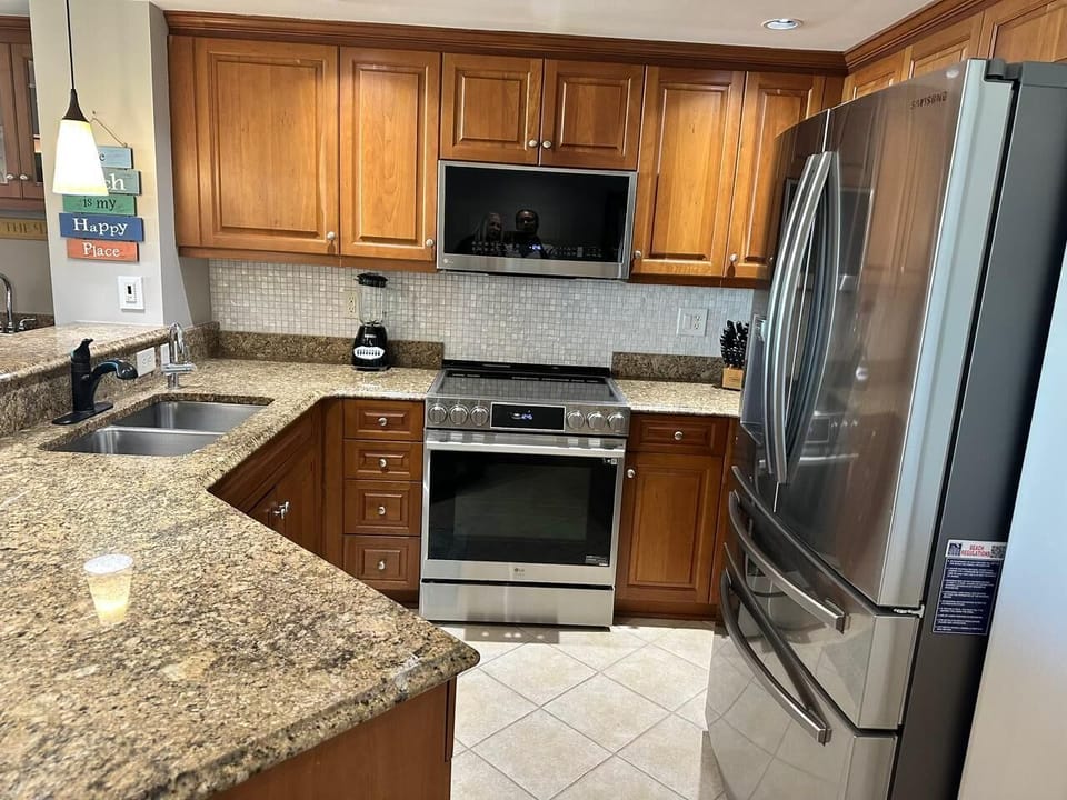 Modern kitchen with granite countertops and stainless steel appliances