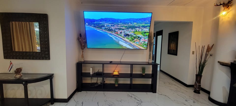 Luxury living room with 85' HD Smart TV and IPTV service. Watch everything!