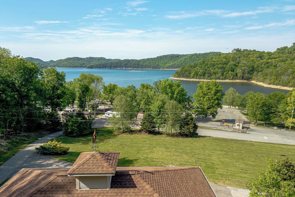 Scenic walk to lakeshore, playground, beach, & boat ramp-family fun steps away.
