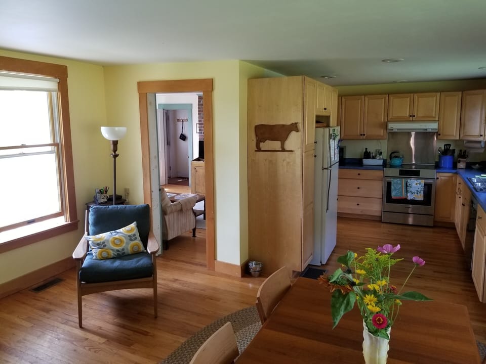 Dining/living area. The wood stove is behind to the left.