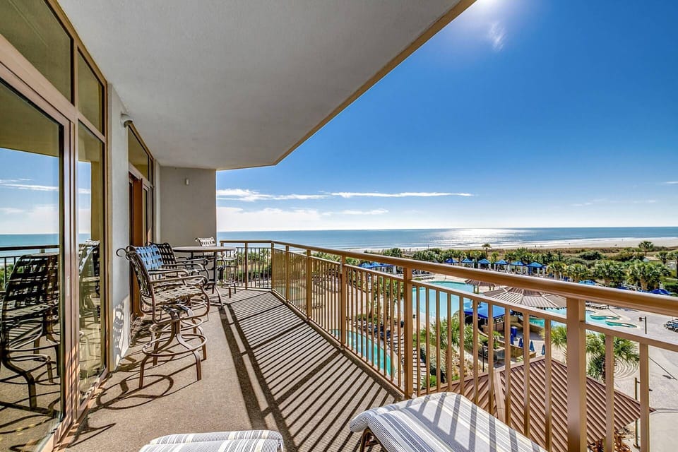 4th-floor balcony — the perfect perch for sweeping ocean and pool views.