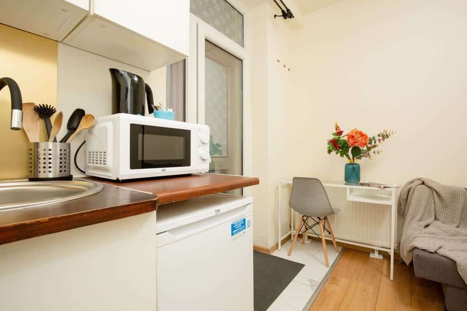 A close-up of the kitchen corner with a microwave.
