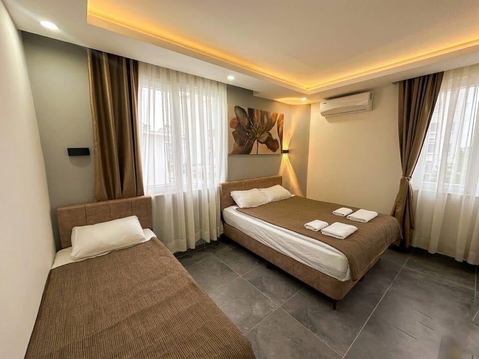 Standard Triple Room (without balcony) | Minibar, in-room safe, blackout drapes, iron/ironing board
