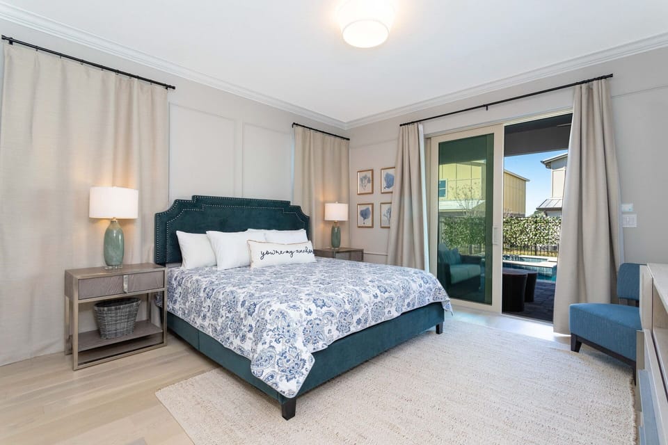 Bedroom #1: King-size bed master suite downstairs w/ door leading to the pool area.