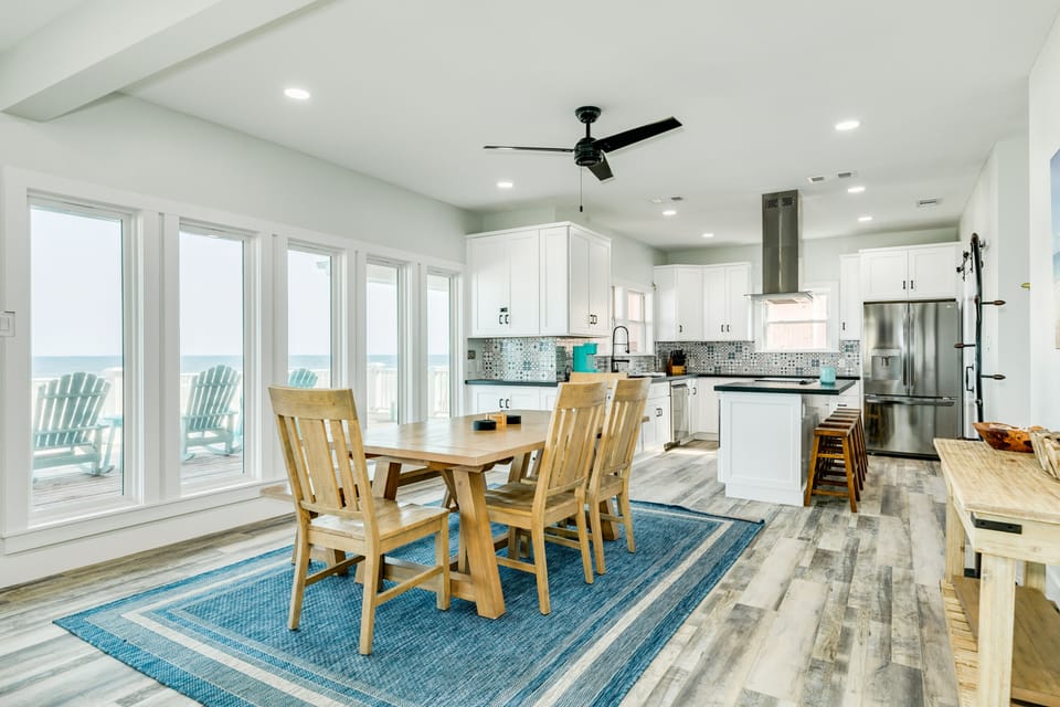 The adjacent kitchen is fully equipped for homecooked meals
